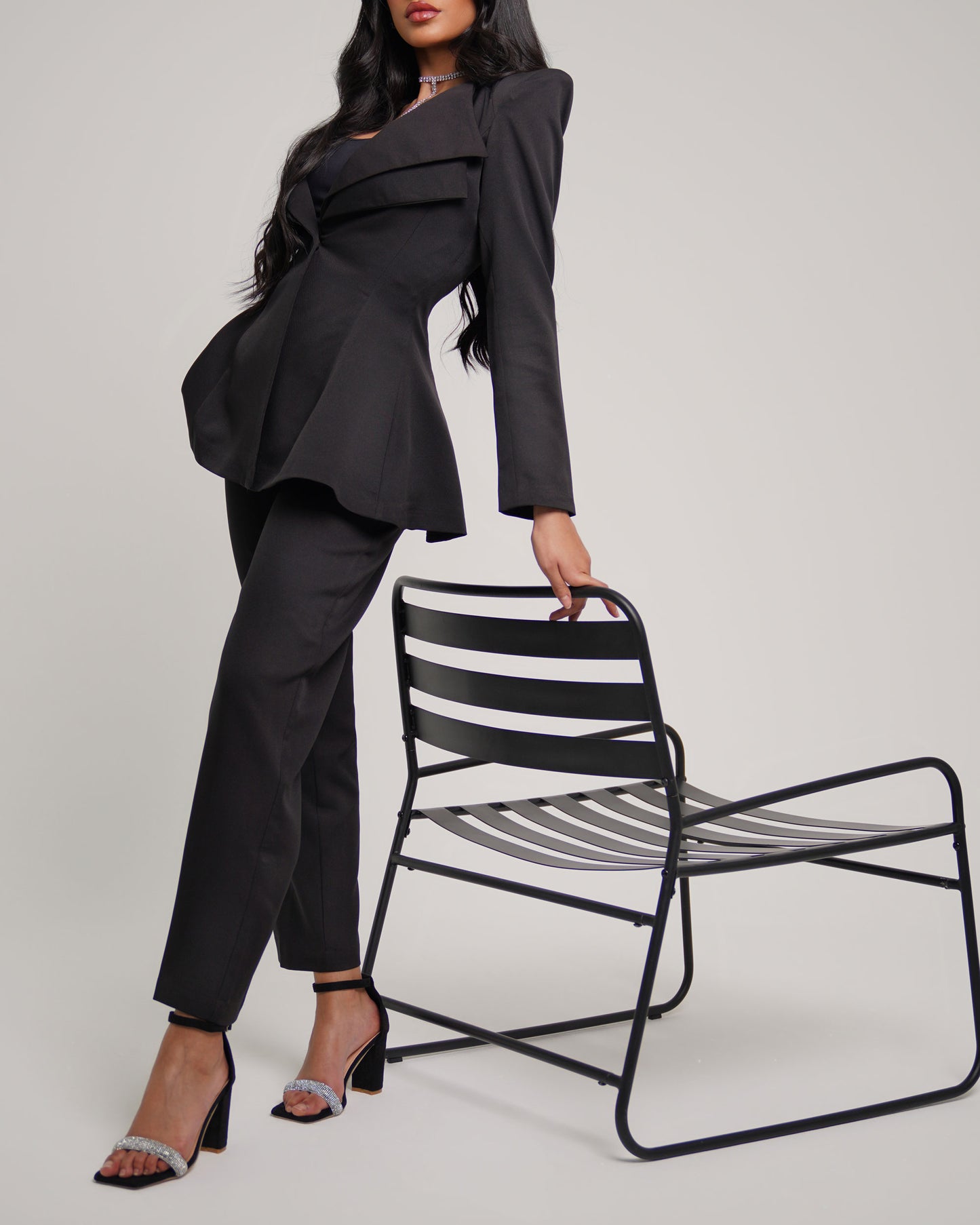 Noir Pointed shoulder double collar blazer paired with straight leg trousers