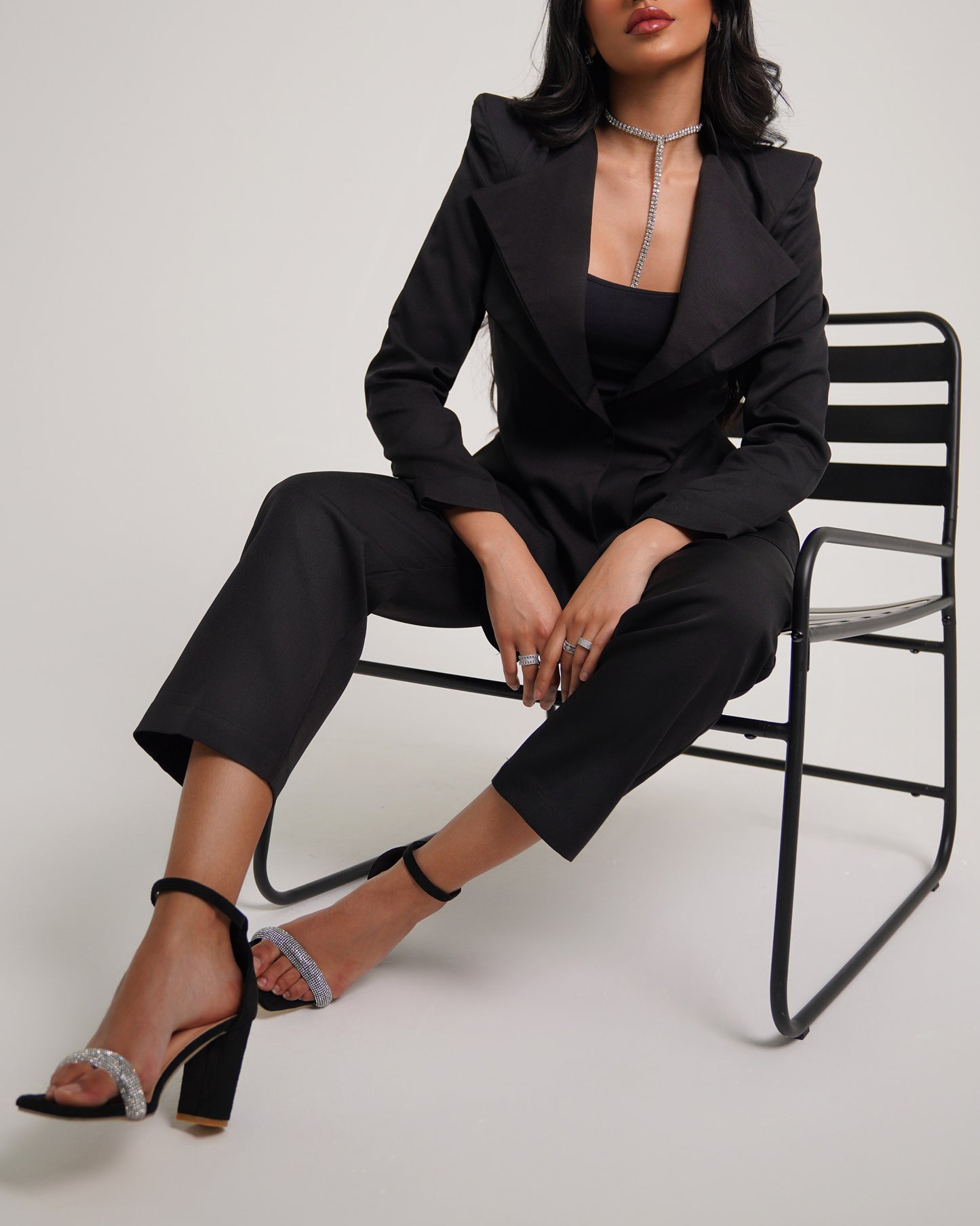 Noir Pointed shoulder double collar blazer paired with straight leg trousers
