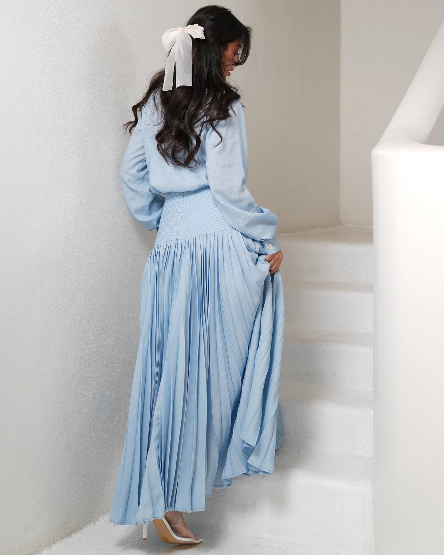 Pleated icy blue skirt with buttons up shirt