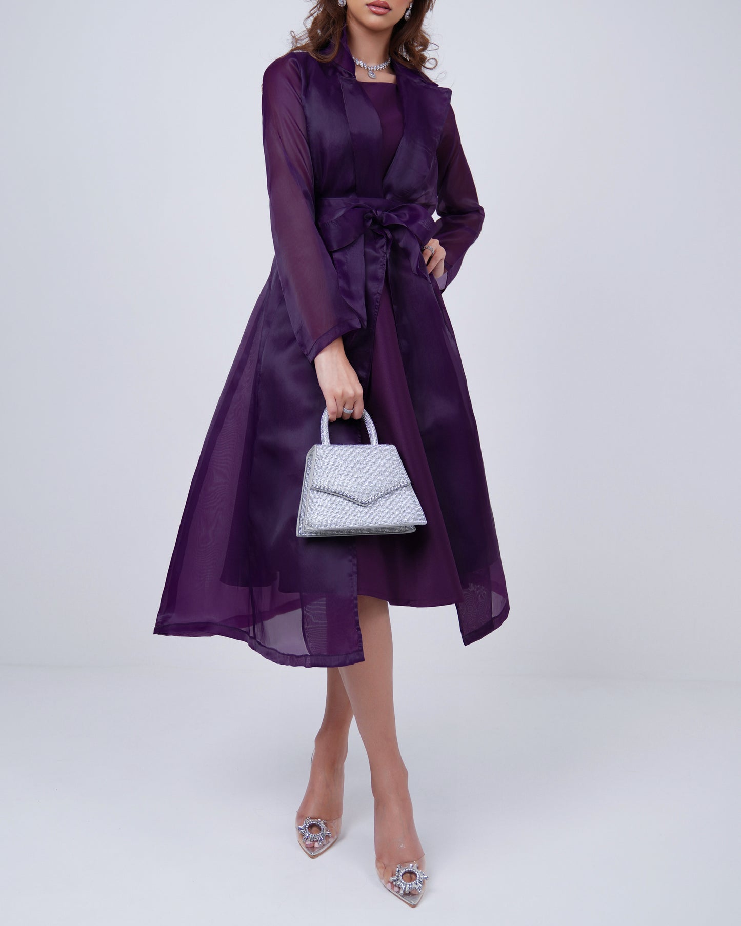 Satin dress topped with organza belted jacket in royal regalia