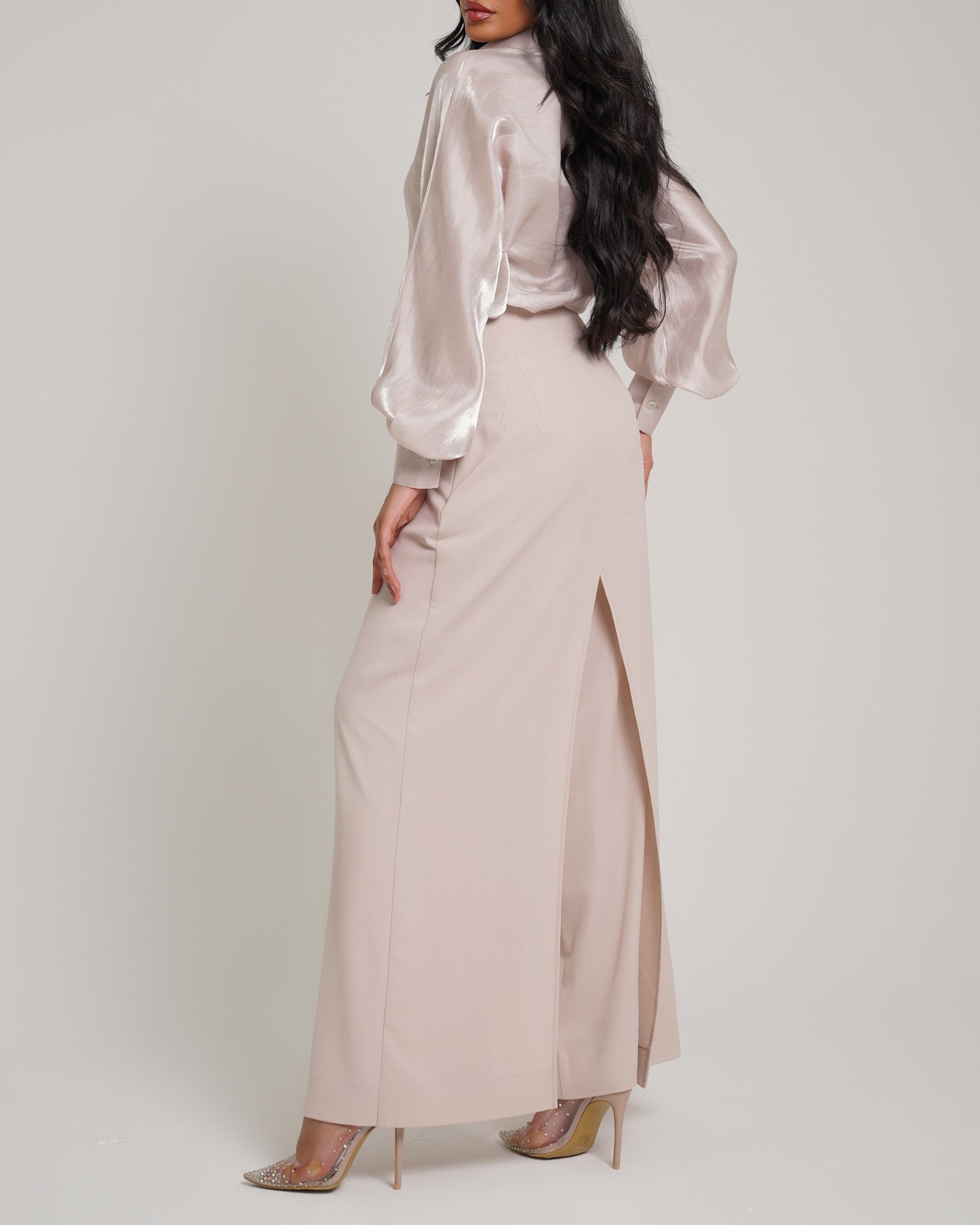 Overlapped corset waist trousers paired with organza shirt