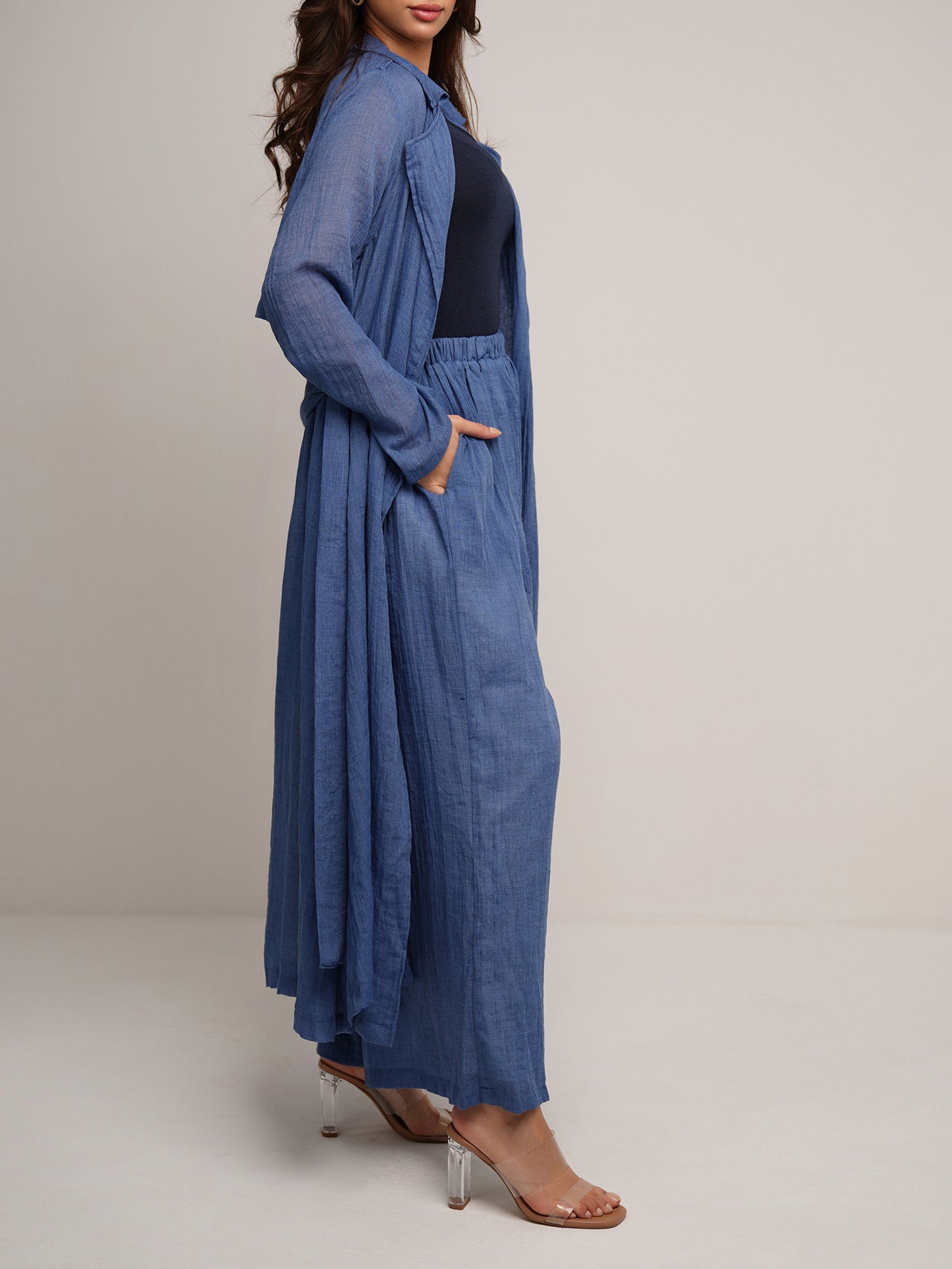 Indigo wash longline trench coat with wide leg trousers