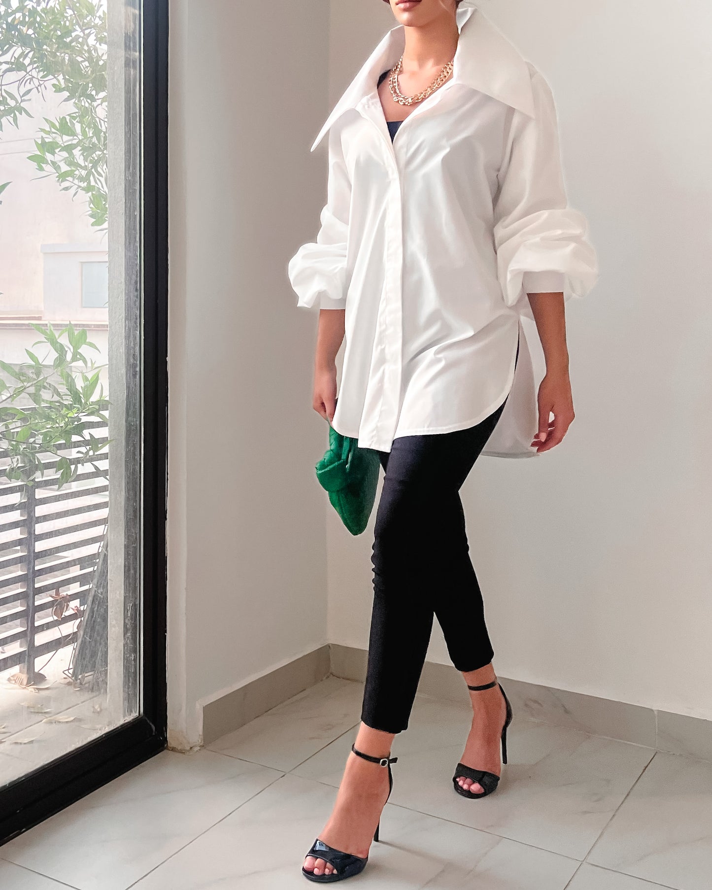 Oversized white cotton shirt with exaggerated collar in white