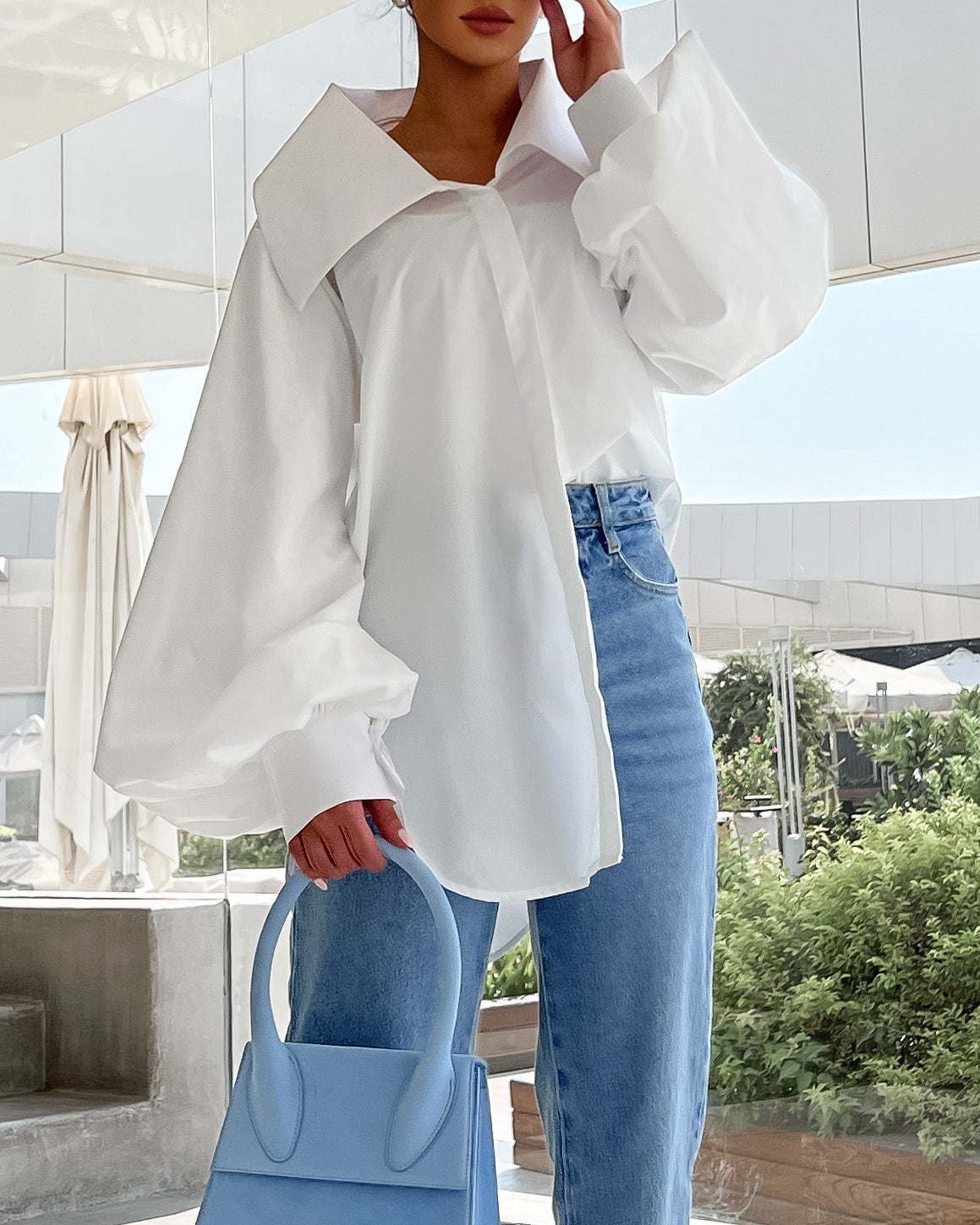Oversized white cotton shirt with exaggerated collar in white